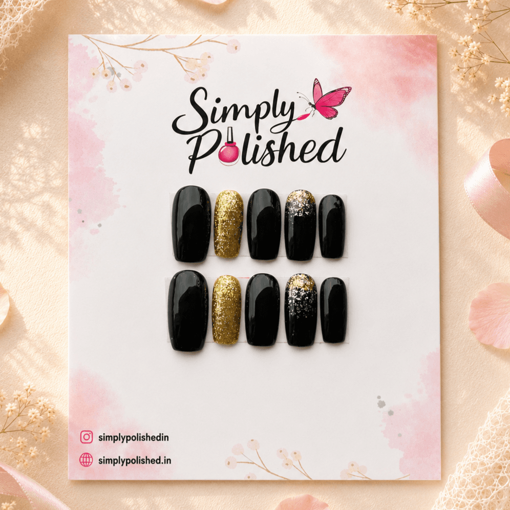 Handcrafted press-on nails with black sparkle and starry night-sky nail art.