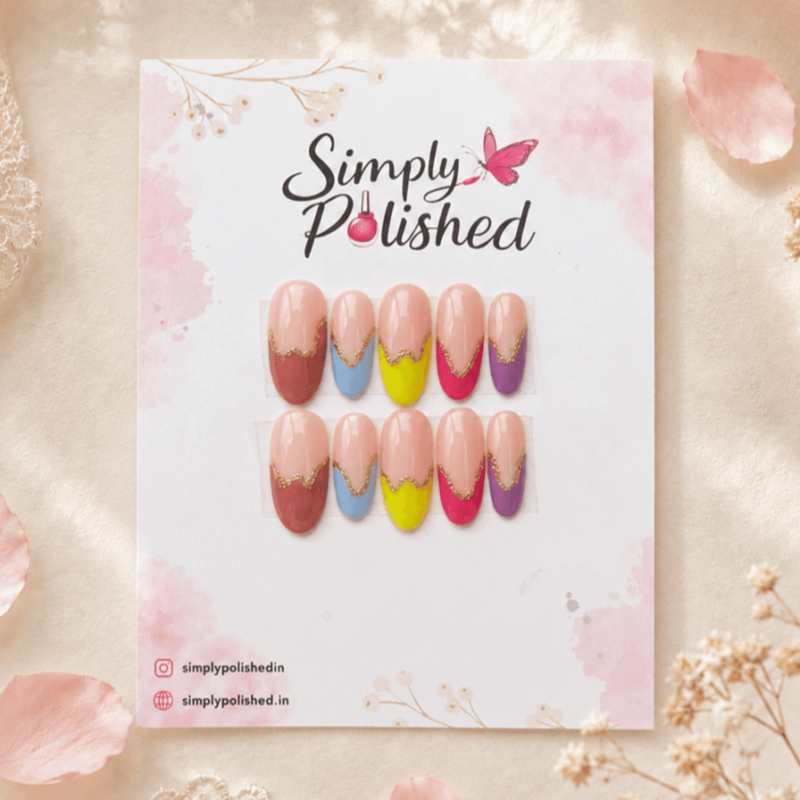 Handcrafted press-on nails with bright Holi-inspired colour accents and a glossy finish.