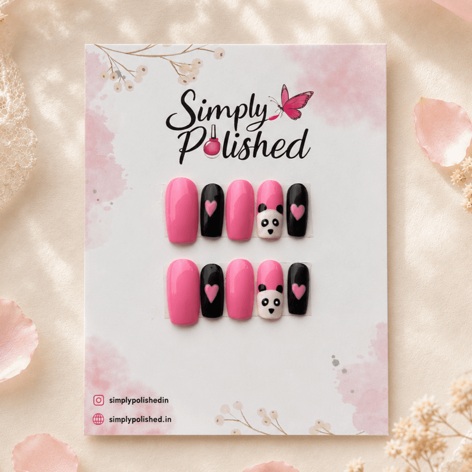 Handcrafted press-on nails with cute panda-inspired black and white nail art.
