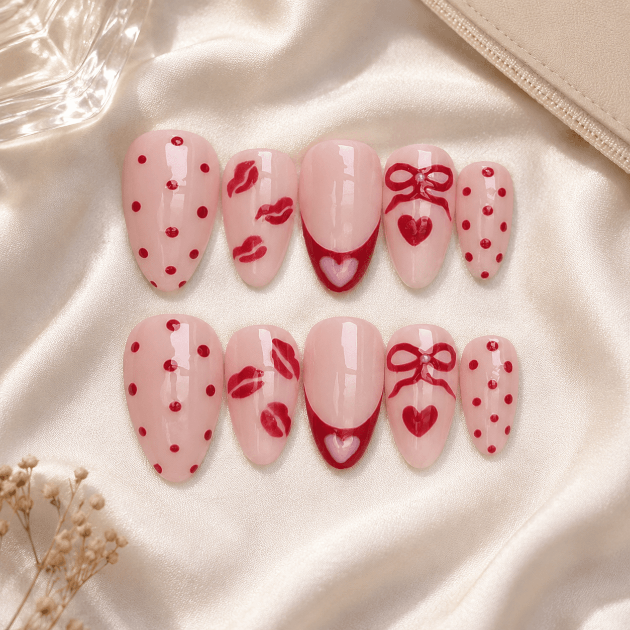 Handcrafted press-on nails with bold red lip art and a glossy soft gel finish.