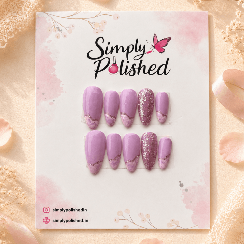 Handcrafted press-on nails with soft lavender marble swirls and a glossy finish.